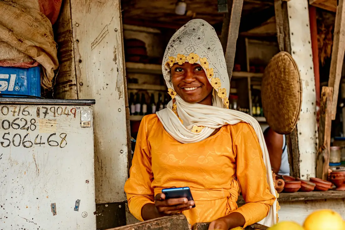 Trader at a market stall with goods ready to move